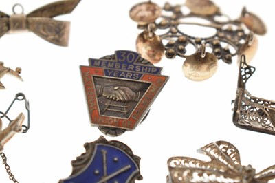 Lot 205 - Elizabeth II silver cigar cutter, silver fob, selection of silver brooches and white metal examples