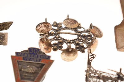 Lot 205 - Elizabeth II silver cigar cutter, silver fob, selection of silver brooches and white metal examples