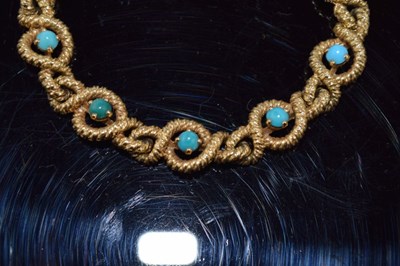 Lot 114 - Cartier, a turquoise set gold bracelet