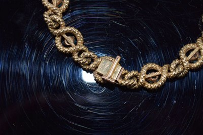 Lot 114 - Cartier, a turquoise set gold bracelet