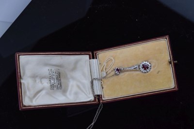 Lot 58 - Diamond and ruby cluster drop pendant