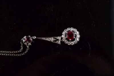 Lot 58 - Diamond and ruby cluster drop pendant