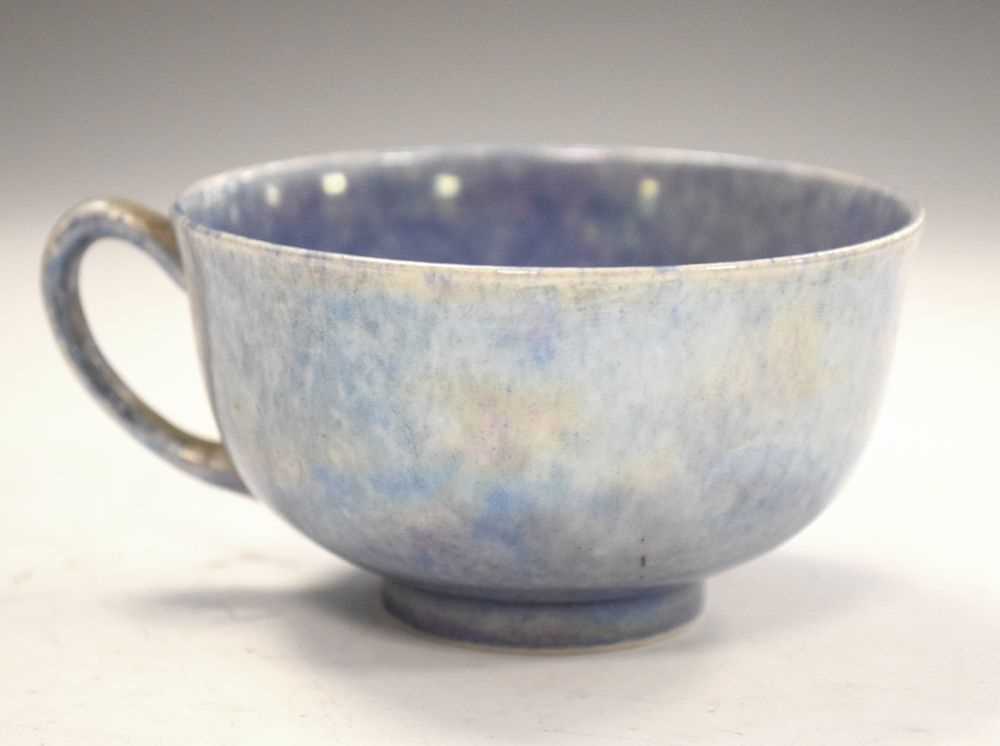 Lot 399 - Ruskin pottery tea cup in  lustre blue glaze