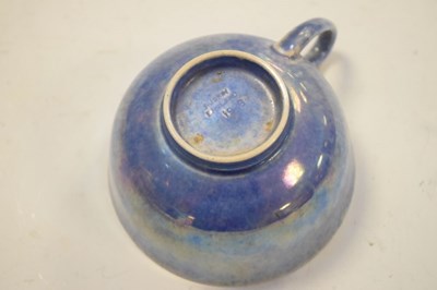 Lot 399 - Ruskin pottery tea cup in  lustre blue glaze
