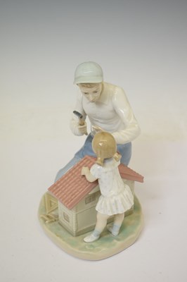 Lot 653 - Lladro - Porcelain figure group, 'A New Dolls House', 5139