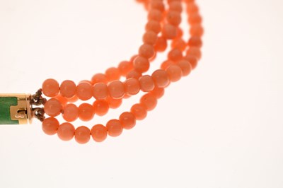 Lot 180 - Coral four-strand bracelet with French gold and green enamel clasp