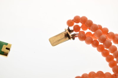 Lot 180 - Coral four-strand bracelet with French gold and green enamel clasp