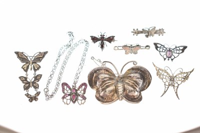 Lot 101 - Collection of seven butterfly brooches and a ruby set butterfly pendant necklace
