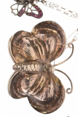 Lot 101 - Collection of seven butterfly brooches and a ruby set butterfly pendant necklace