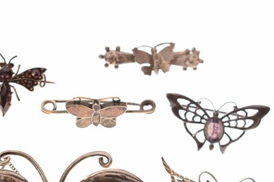 Lot 101 - Collection of seven butterfly brooches and a ruby set butterfly pendant necklace