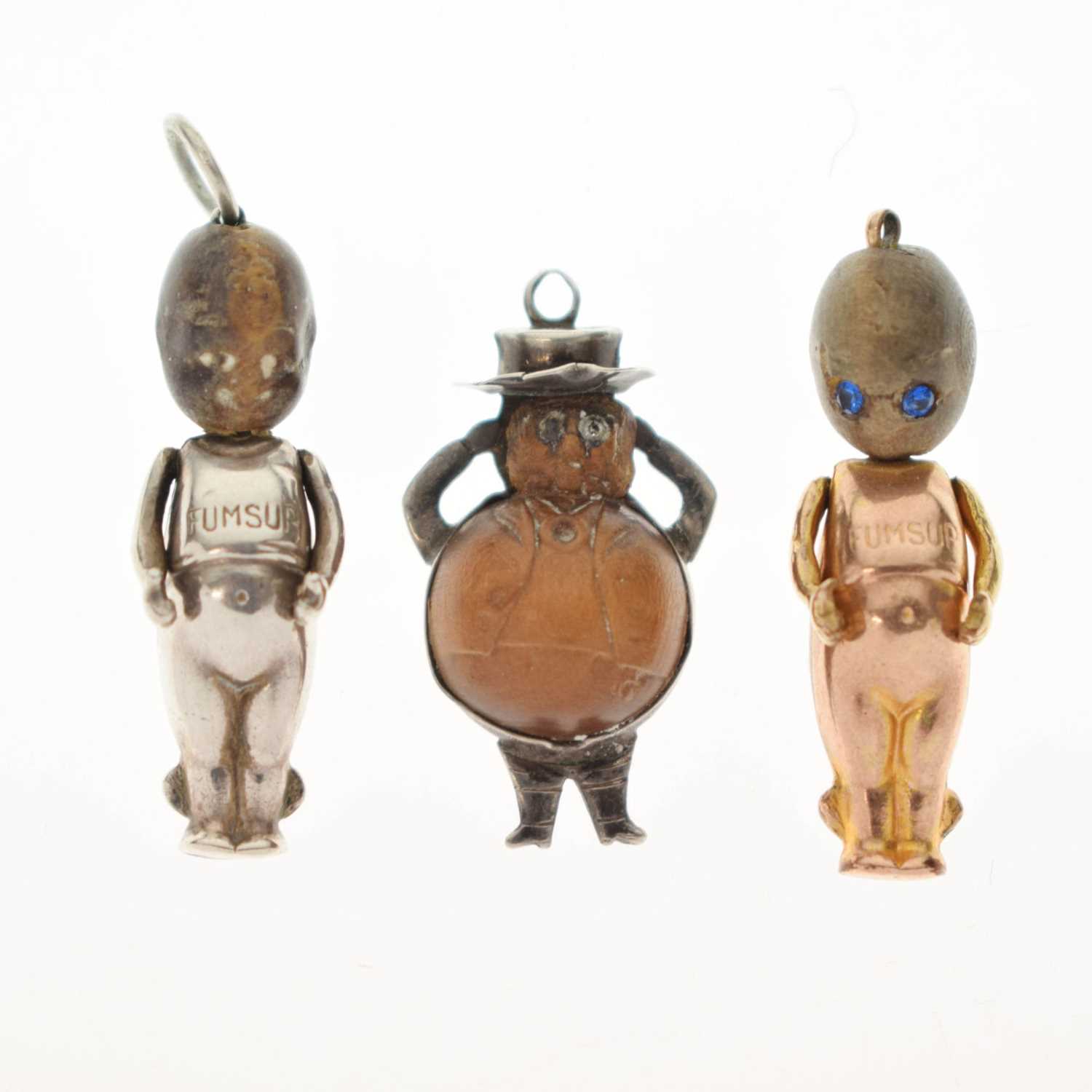 Lot 237 - Two Great War era 'Fumsup' charms and a John Bull charm