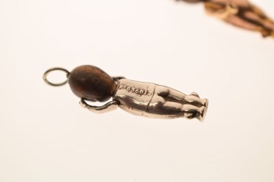 Lot 237 - Two Great War era 'Fumsup' charms and a John Bull charm