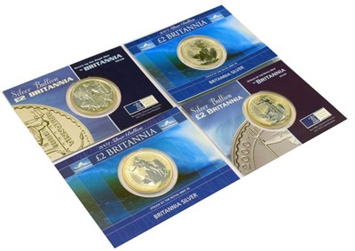 Lot 184 - Four Royal Mint Britannias presentation packs, 2000, 2001, 2002 and 2004
