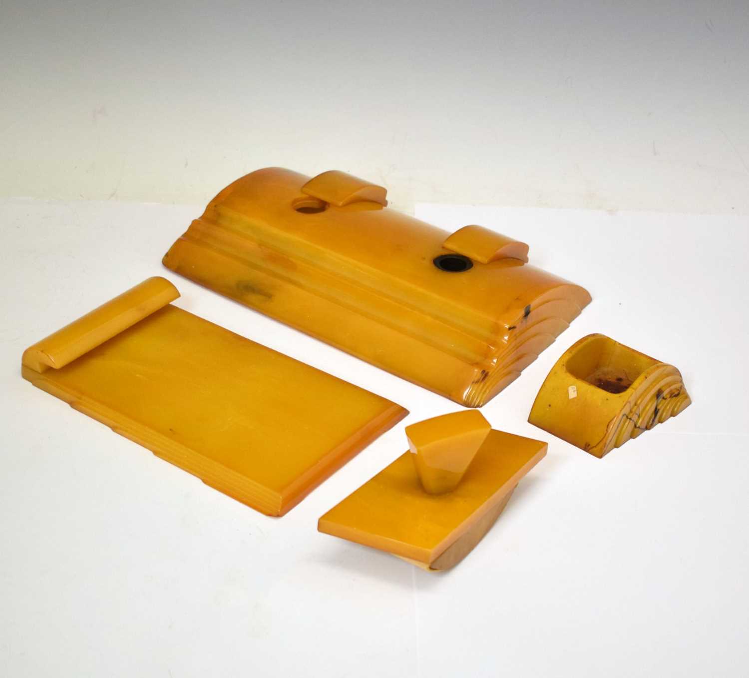 Lot 362 - Four Art Deco amber Bakelite desk items