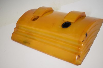 Lot 362 - Four Art Deco amber Bakelite desk items