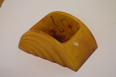 Lot 362 - Four Art Deco amber Bakelite desk items