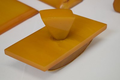 Lot 362 - Four Art Deco amber Bakelite desk items