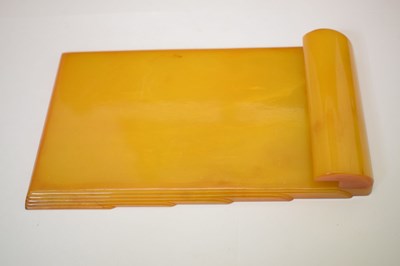 Lot 362 - Four Art Deco amber Bakelite desk items