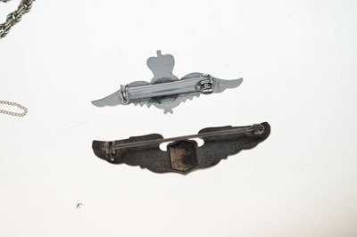 Lot 185 - American 'Amico' silver wings brooch, a RAF wings brooch, etc