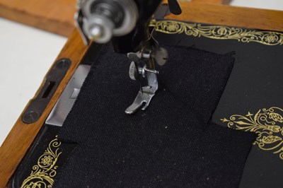 Lot 379 - Cased Singer sewing machine and case