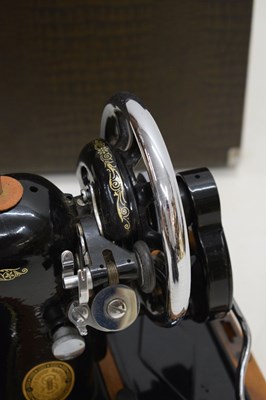 Lot 379 - Cased Singer sewing machine and case