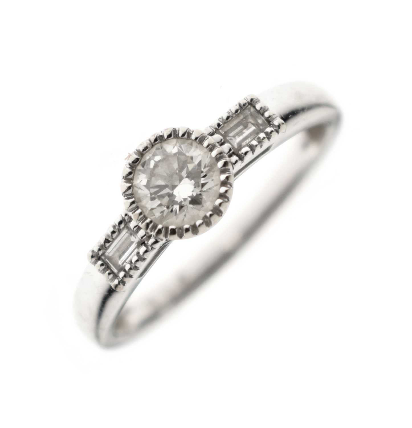 Lot 1 - Diamond single stone ring with baguette cut diamond shoulders
