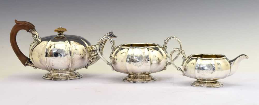 Lot 172 - George IV silver three-piece silver tea set of melon-shaped form