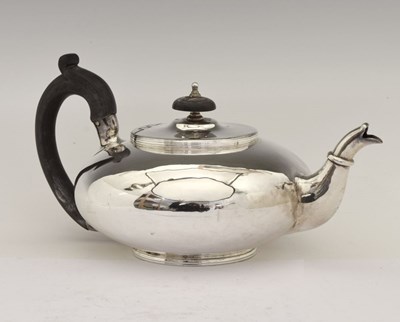 Lot 173 - George III silver teapot of squat form with scroll handle