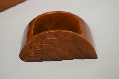 Lot 361 - Art Deco amber bakelite desk accessories