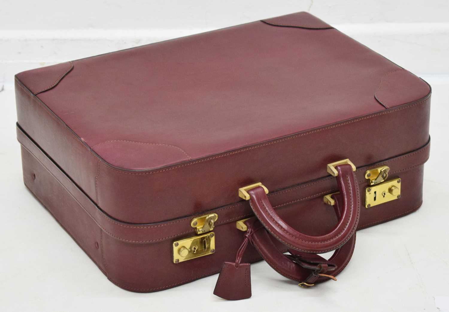 Lot 425 - Laurence Torino Italian claret-coloured leather suitcase