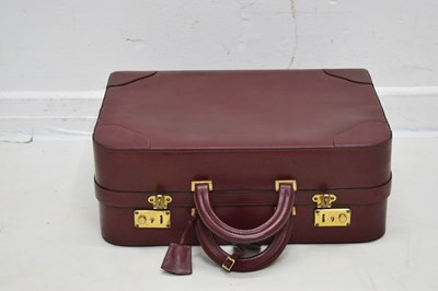 Lot 425 - Laurence Torino Italian claret-coloured leather suitcase