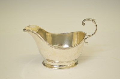 Lot 304 - George VI silver sauce boat with flying scroll handle