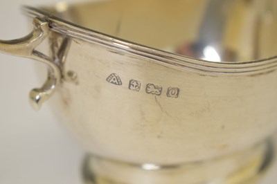 Lot 304 - George VI silver sauce boat with flying scroll handle