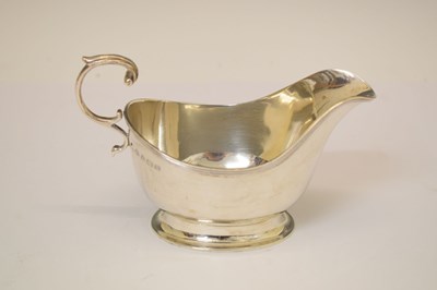 Lot 304 - George VI silver sauce boat with flying scroll handle
