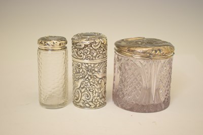 Lot 275 - George VI silver toast rack, together with a collection of silver mounted dressing table requisites