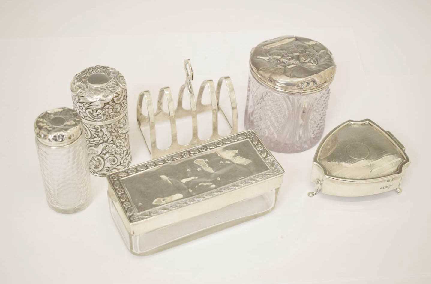 Lot 275 - George VI silver toast rack, together with a collection of silver mounted dressing table requisites