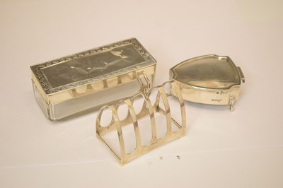 Lot 275 - George VI silver toast rack, together with a collection of silver mounted dressing table requisites
