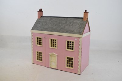 Lot 292 - Large modern pink dolls house and furniture