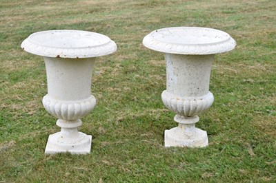 Lot 210 - Pair of white-painted cast iron garden urns