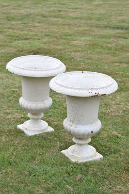 Lot 210 - Pair of white-painted cast iron garden urns
