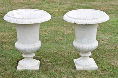 Lot 210 - Pair of white-painted cast iron garden urns