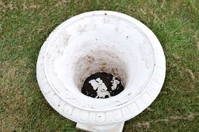 Lot 210 - Pair of white-painted cast iron garden urns
