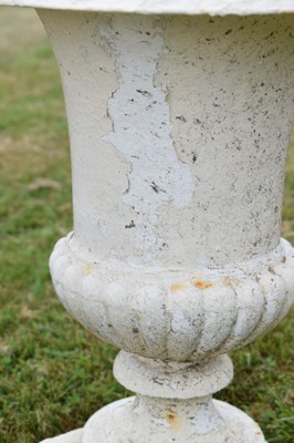 Lot 210 - Pair of white-painted cast iron garden urns