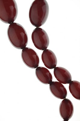 Lot 124 - Cherry bakelite amber beads
