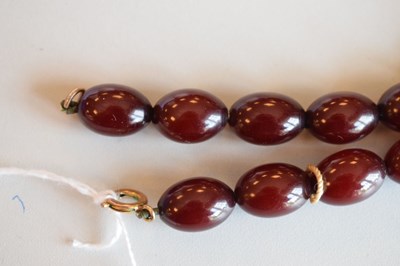 Lot 124 - Cherry bakelite amber beads