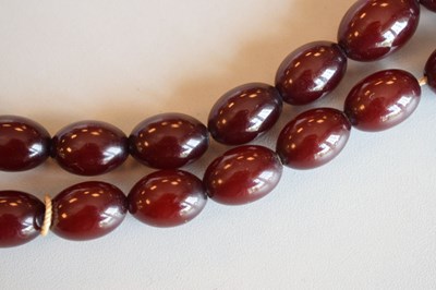 Lot 124 - Cherry bakelite amber beads