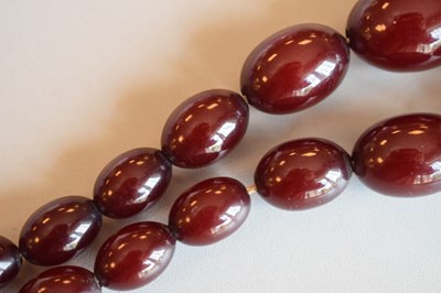 Lot 124 - Cherry bakelite amber beads