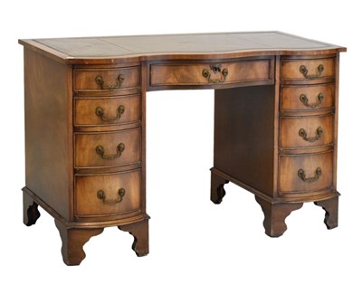 Lot 505 - Reproduction mahogany serpentine twin pedestal desk