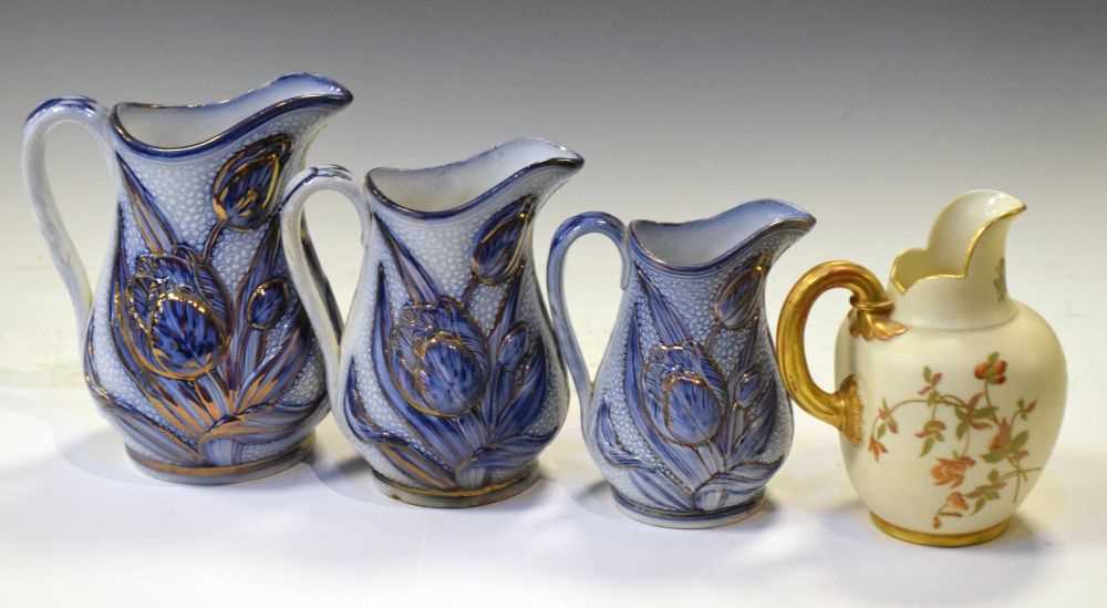 Lot 347 - Royal Worcester flatback jug and graduated set of three Victorian relief-moulded jugs