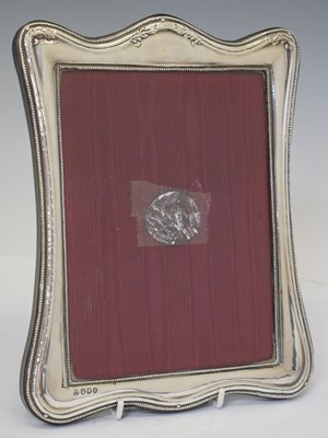 Lot 198 - Elizabeth II silver mounted photograph frame of serpentine form
